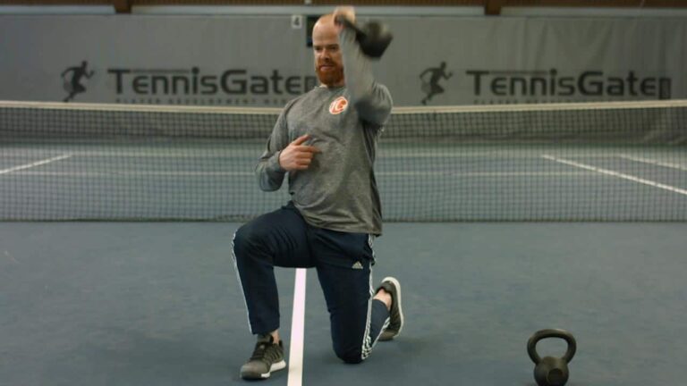 One-arm upside-down kneeling with kettlebell