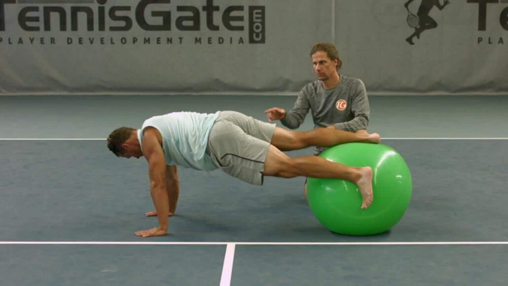 Push-up with rotation of the legs with Pezziball