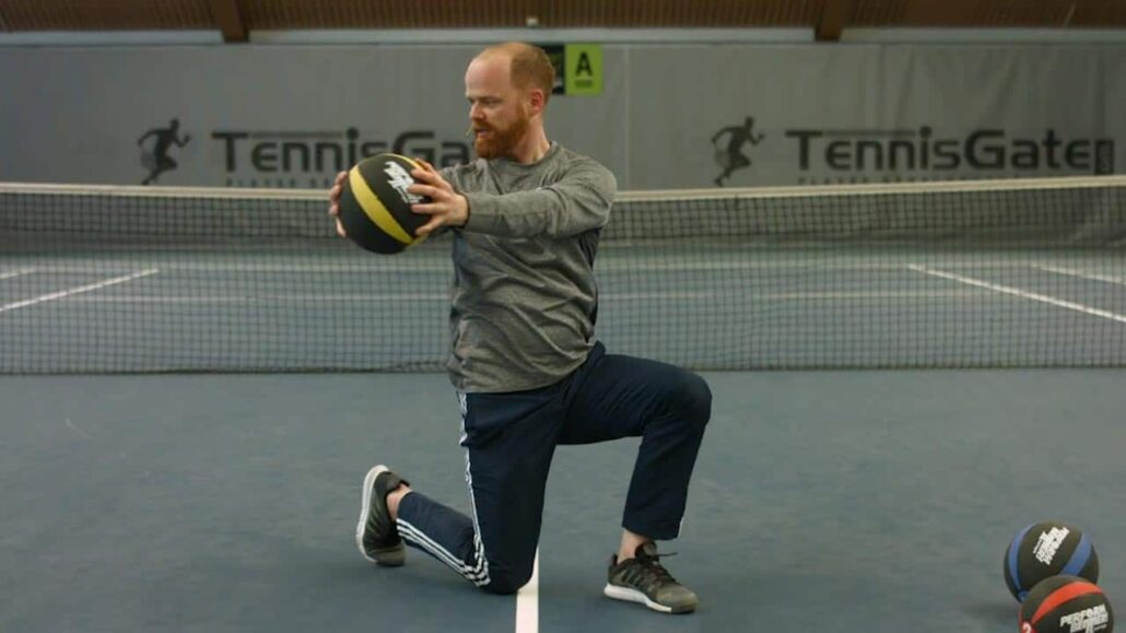 Torso rotation in a half kneeling position with a medicine ball
